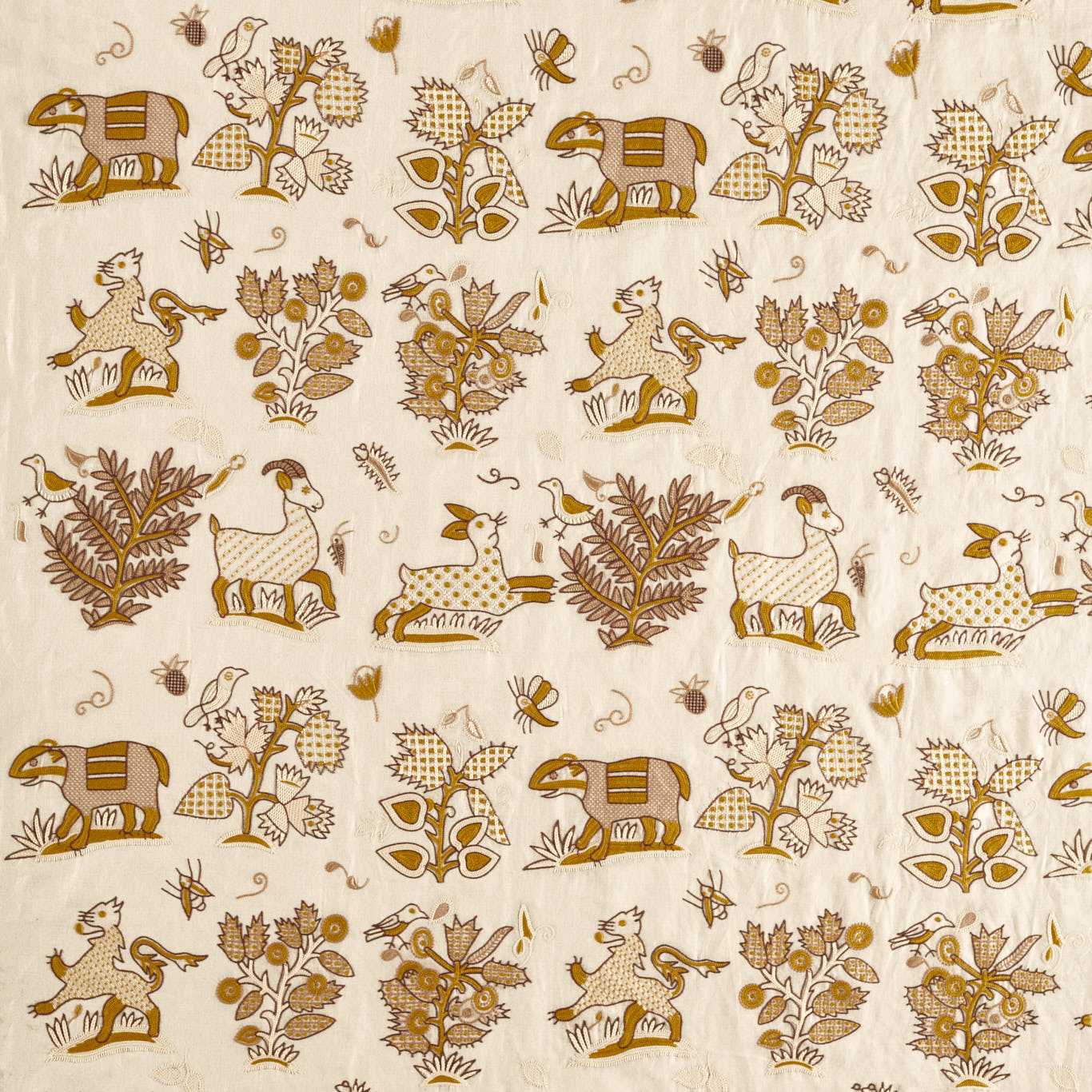Beige fabric with repeating mustard-brown folk-art print featuring elephants, deer, birds, and stylized trees and flowers.