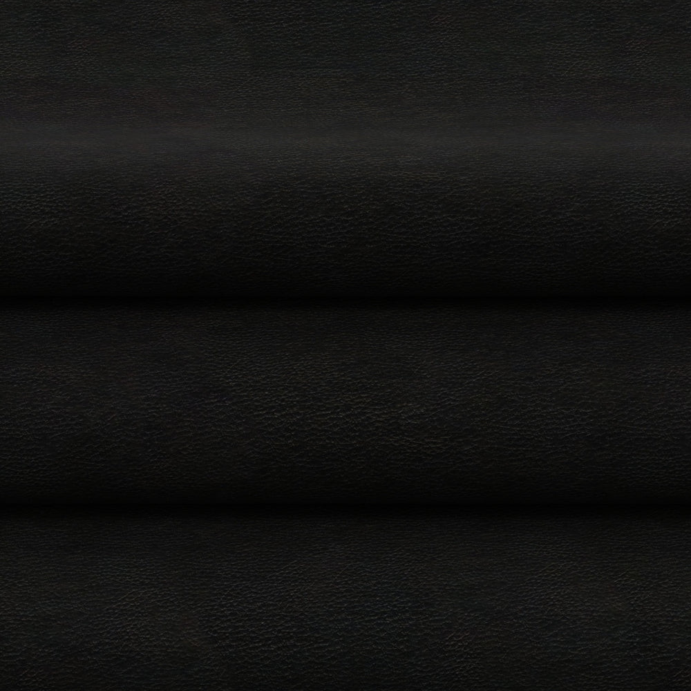 Black solid fabric in flat lay with horizontal folds and subtle grain.