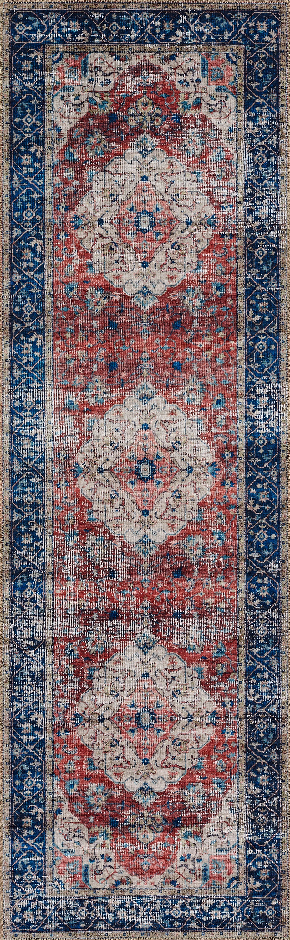 Persian-style runner rug with a cream central field, red floral medallions and blue ornate borders.
