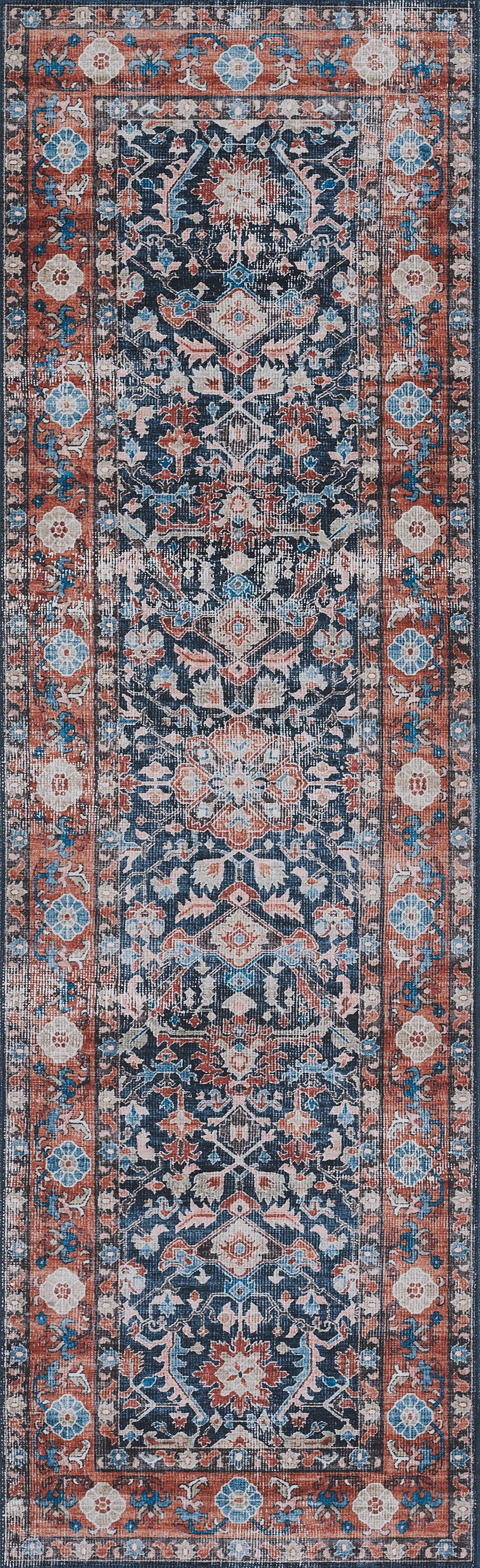 Persian-style runner rug with a navy field, ivory and coral floral motifs, and a red border.