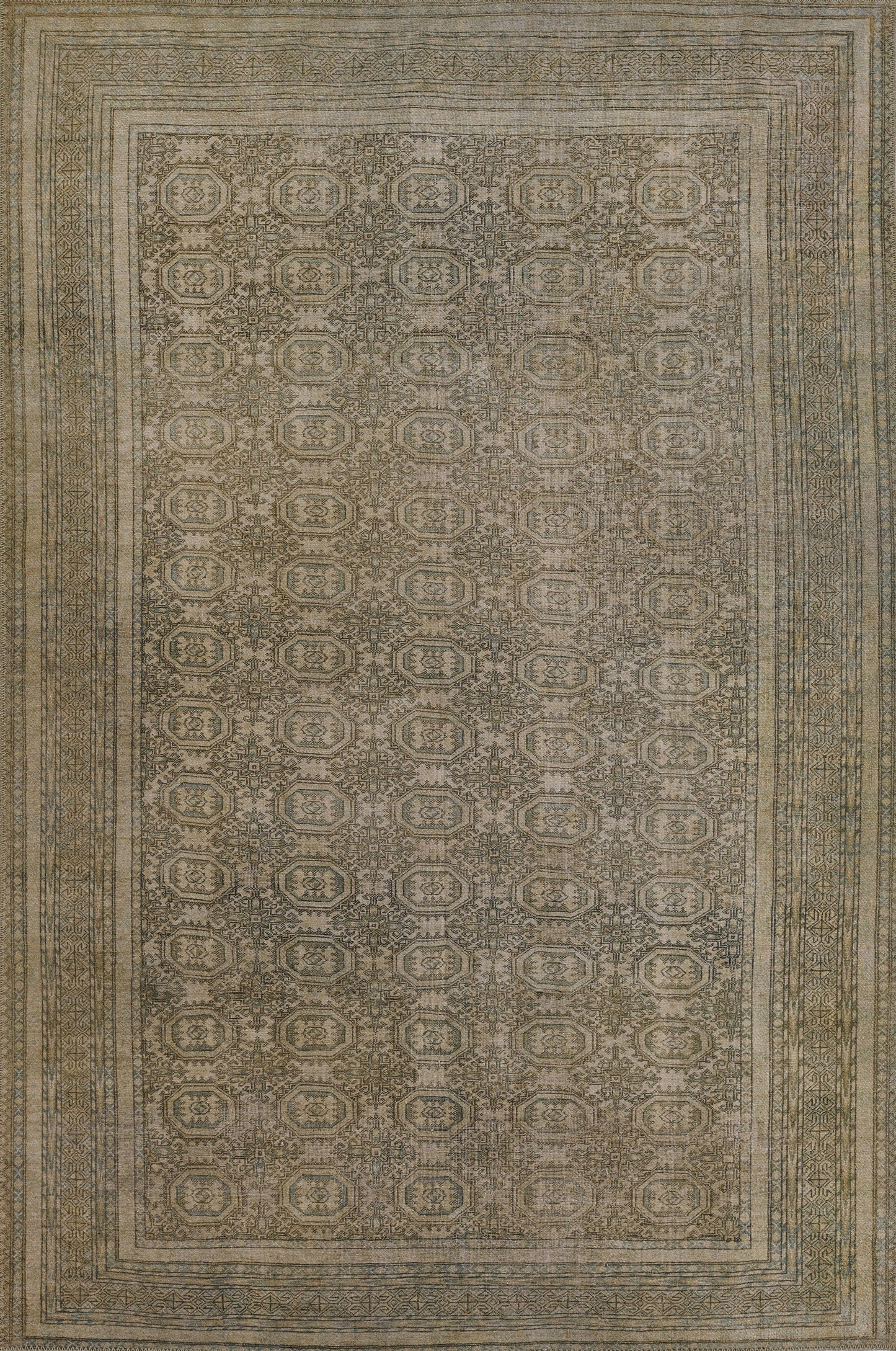 Distressed gray-green oriental rug with repeating circular medallions and layered beige borders.