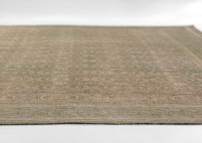 Neutral beige-brown flatweave rug (10' x 14') with a muted geometric pattern and border, ideal for living rooms.