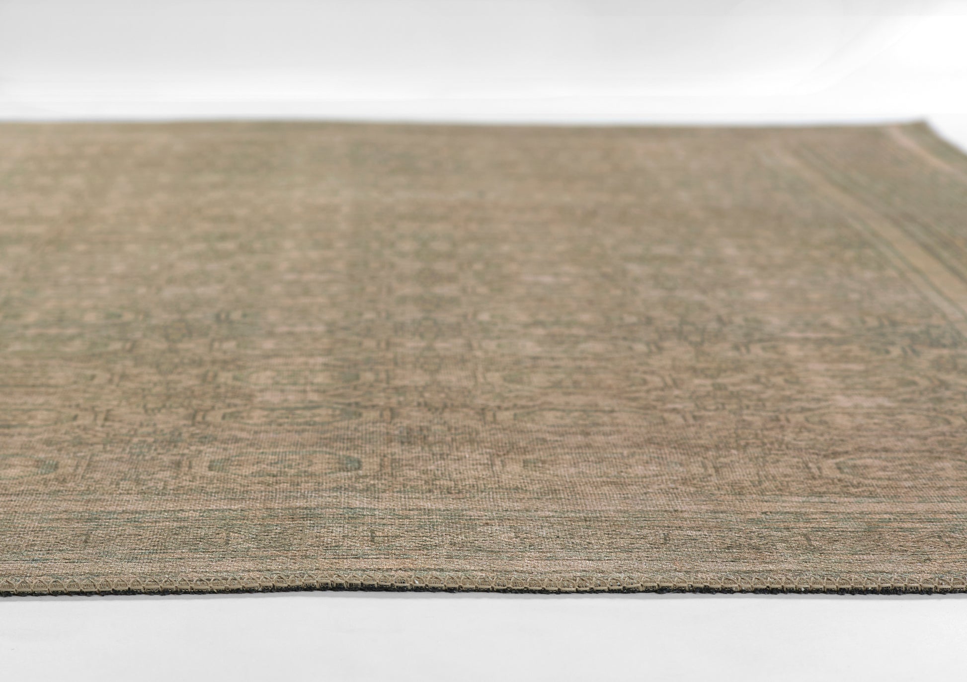 Beige-brown flat-weave rug with a subtle geometric pattern; rectangular shape for living room decor.
