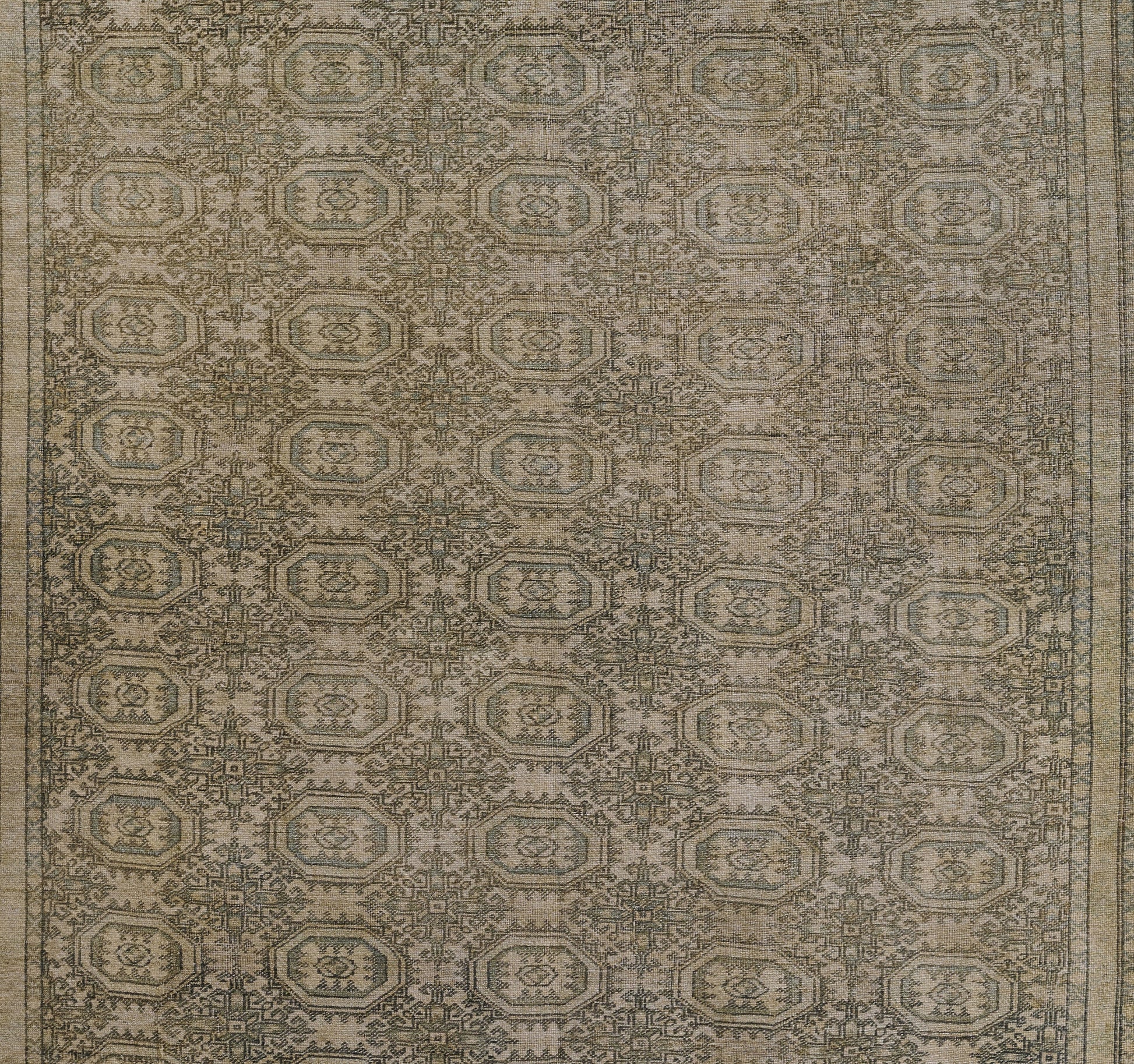 Green-toned oriental rug with repeating octagonal medallions and intricate borders, vintage distressed style.