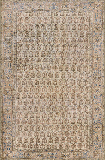 Beige traditional rug with repeated brown oval motifs and an ornate blue-tan border.