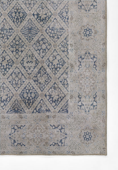 Blue and beige rug featuring diamond lattice center with floral motifs and ornate border.