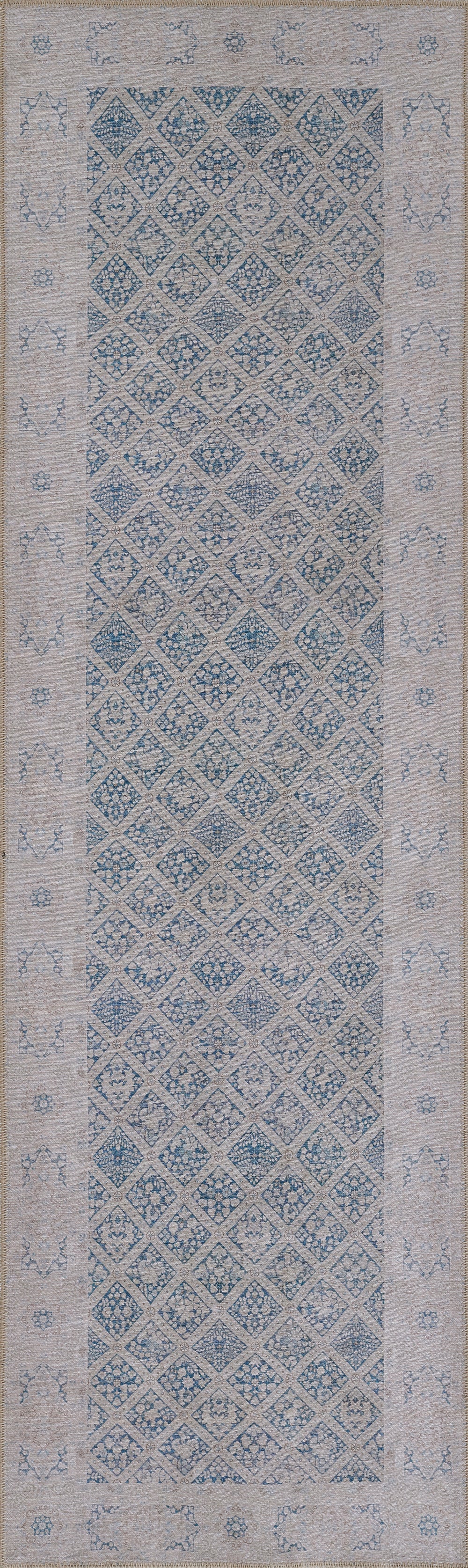 Blue and ivory rug with a diamond lattice pattern and floral border accents.