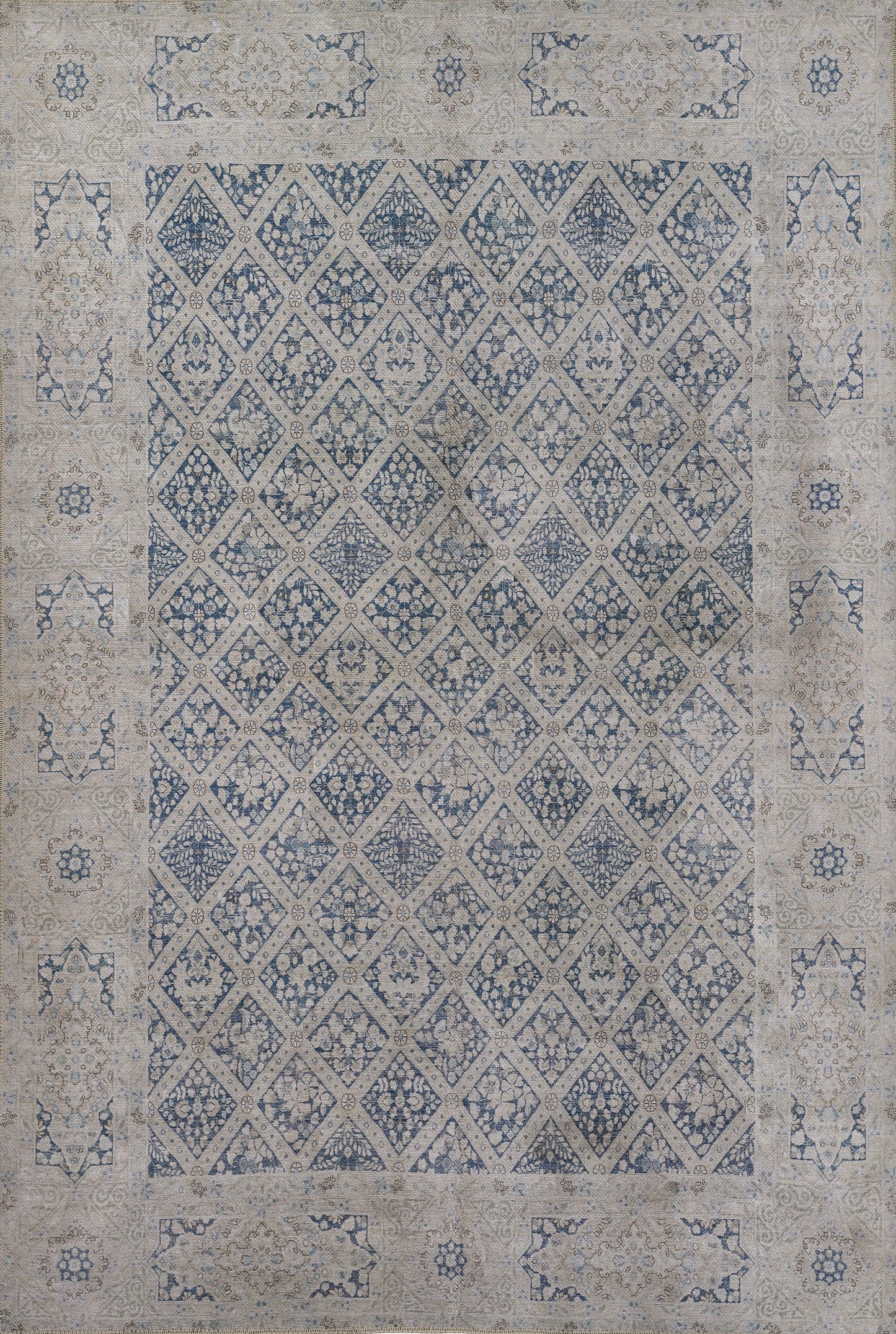 Blue and beige distressed oriental area rug with diamond lattice pattern and floral border.