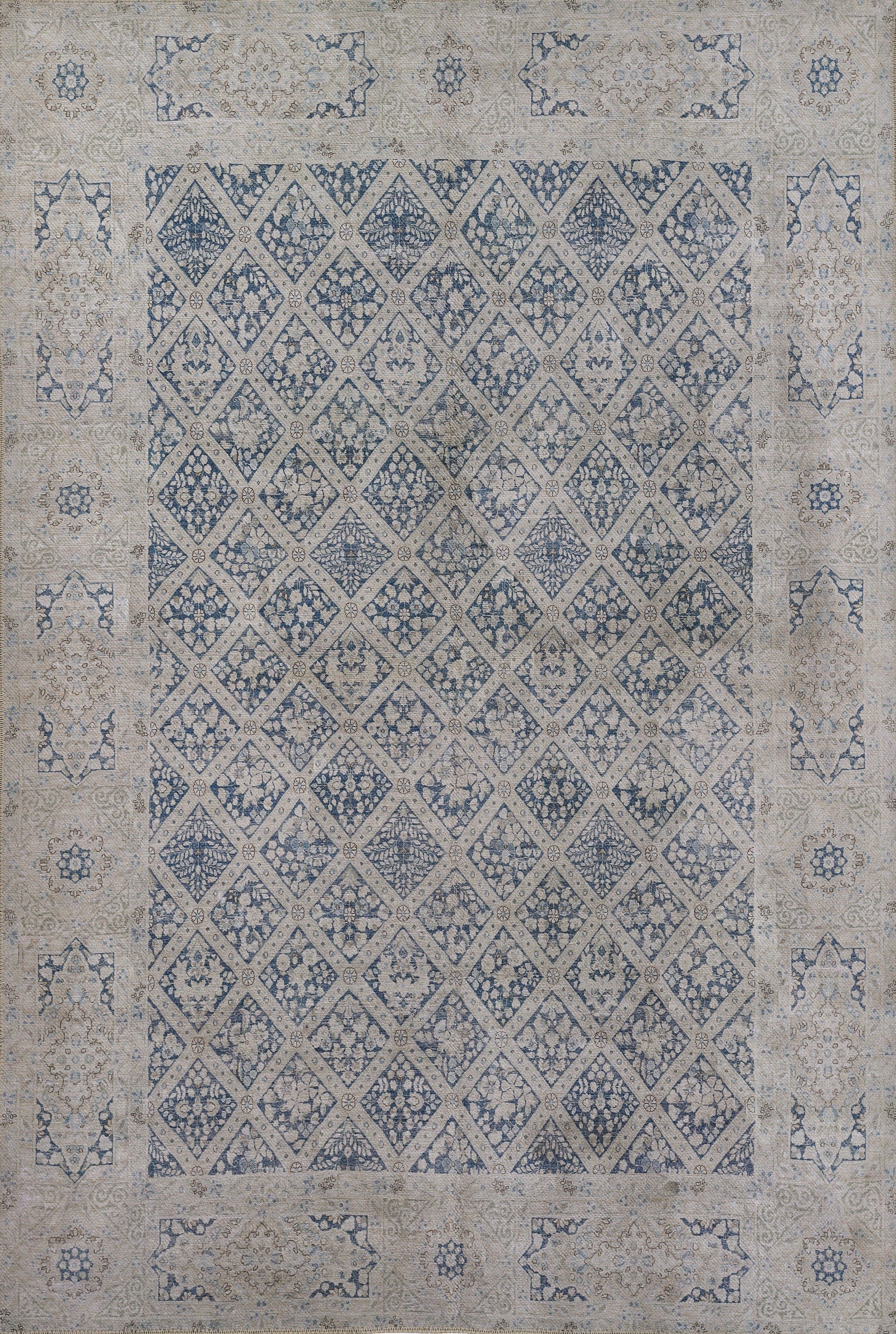 Blue and beige distressed oriental area rug with diamond lattice pattern and floral border.