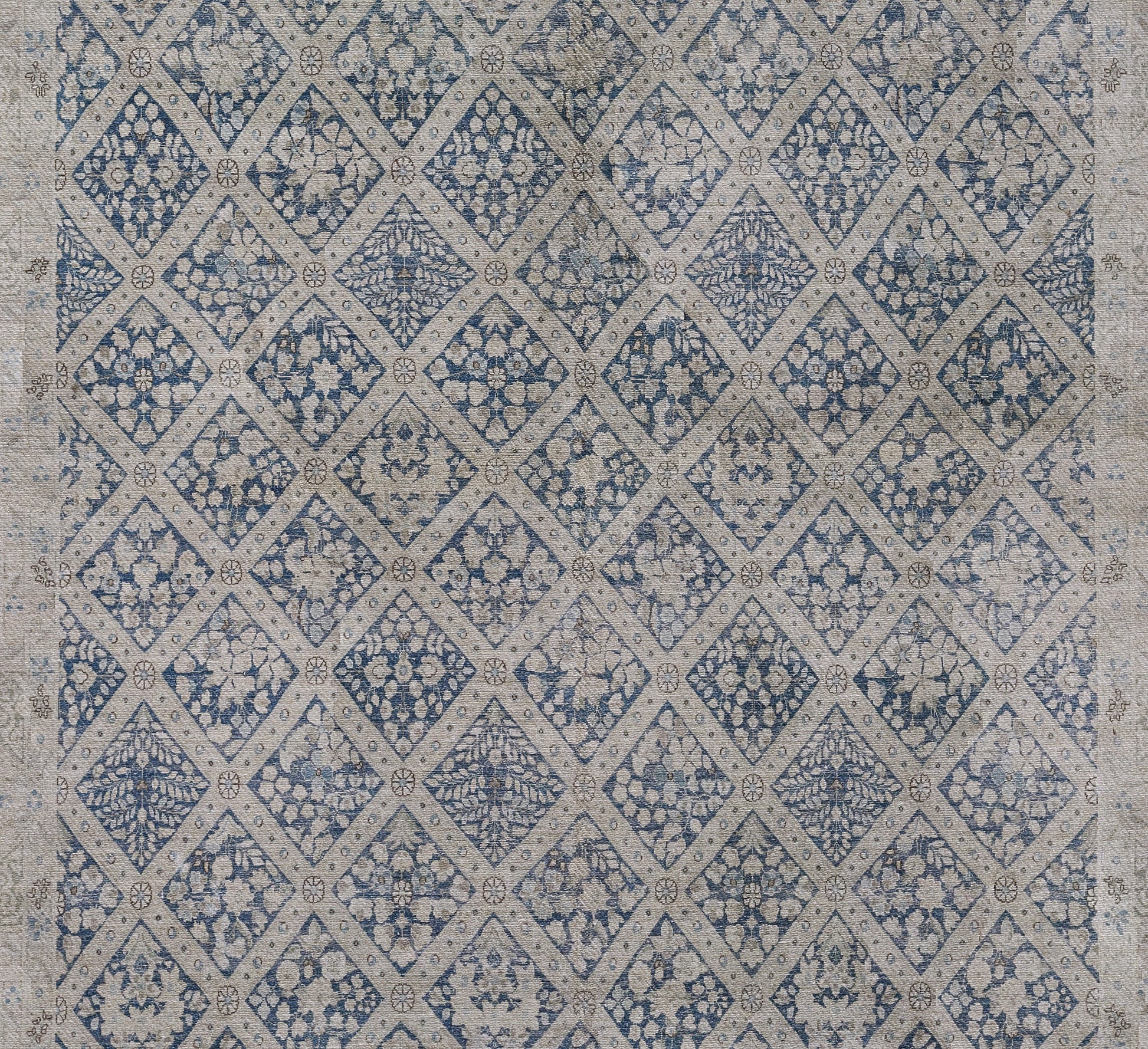 Blue-beige diamond lattice rug with floral medallion clusters; woven textile for boho or traditional home decor.