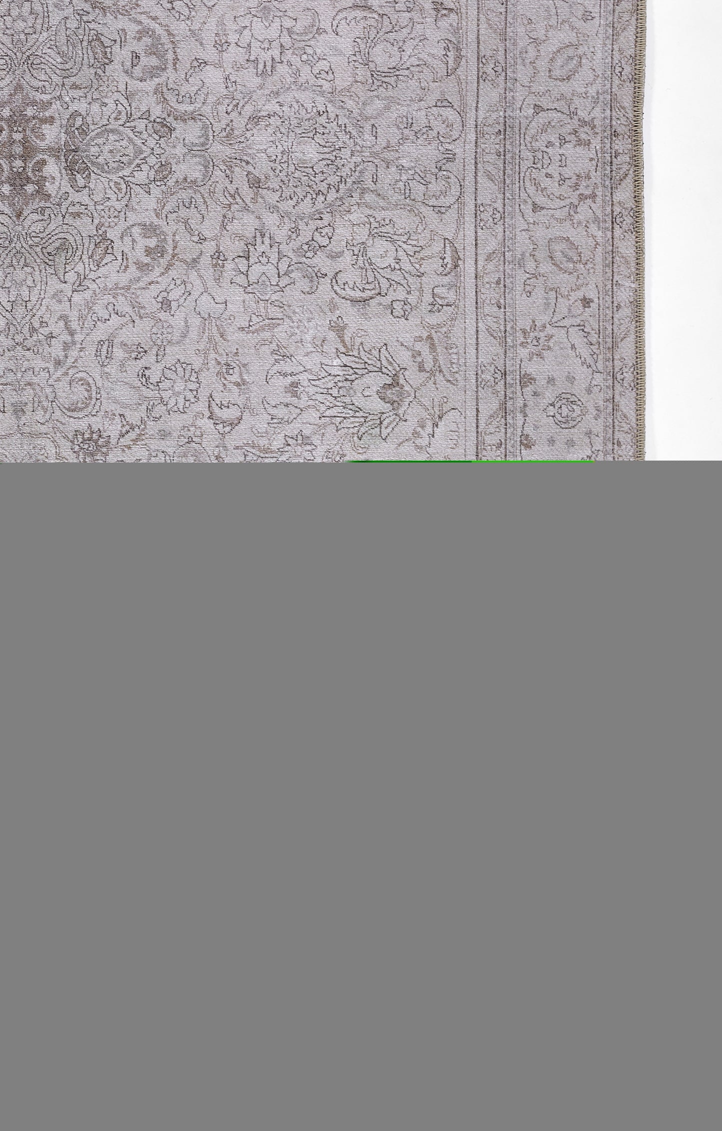 Gray oriental-style rug with an ornate floral pattern and double bordered edges.