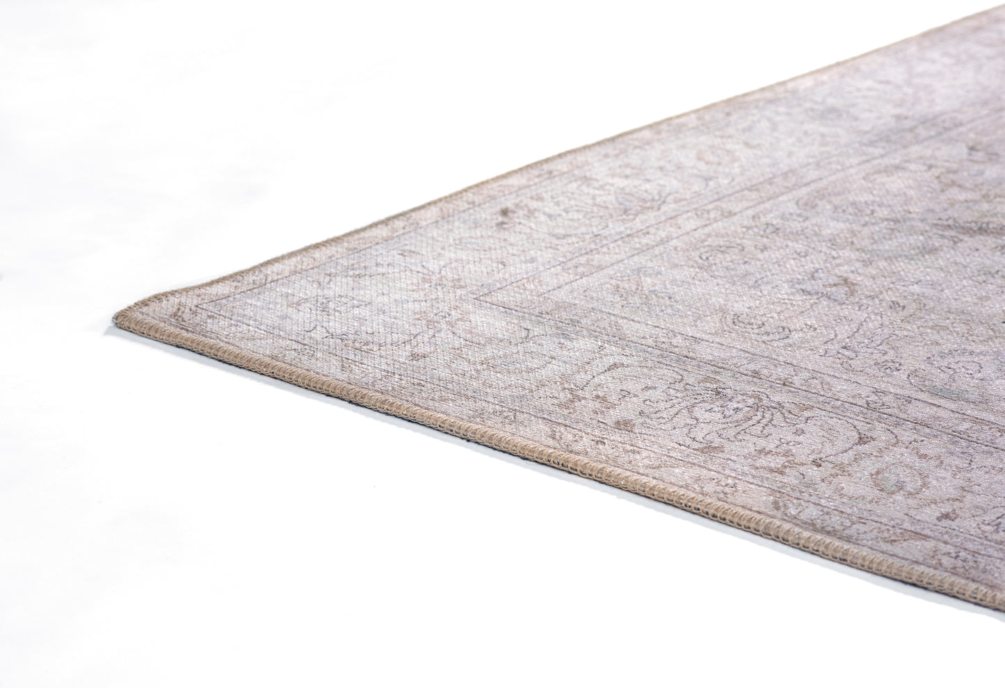 Gray and beige rectangular rug with subtle traditional pattern, low-pile, beige edge.
