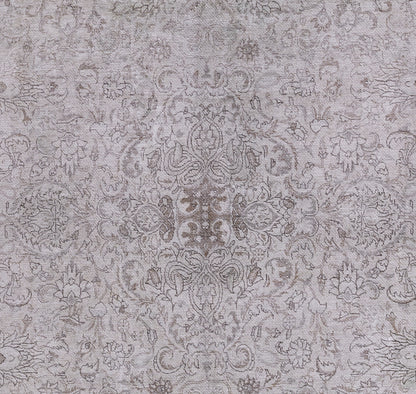 Gray damask patterned area rug with ornate floral medallion design and subtle texture.