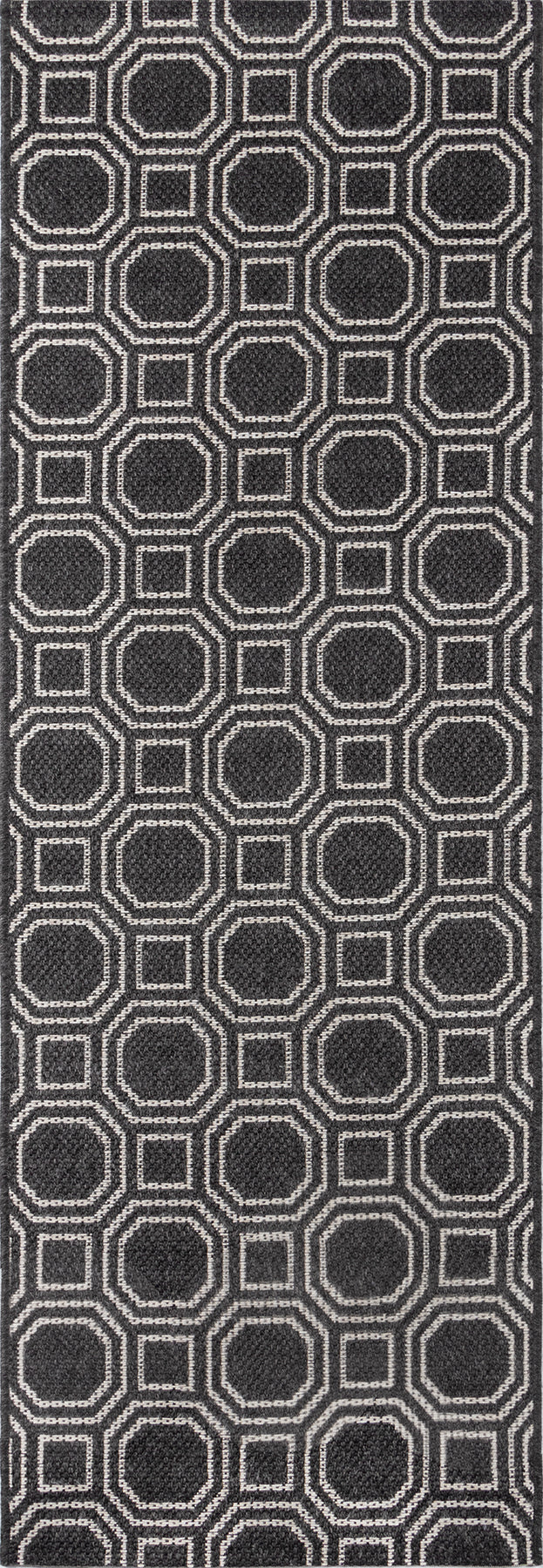 Dark charcoal rug with a repeating light-gray outlined hexagon pattern; geometric modern design.