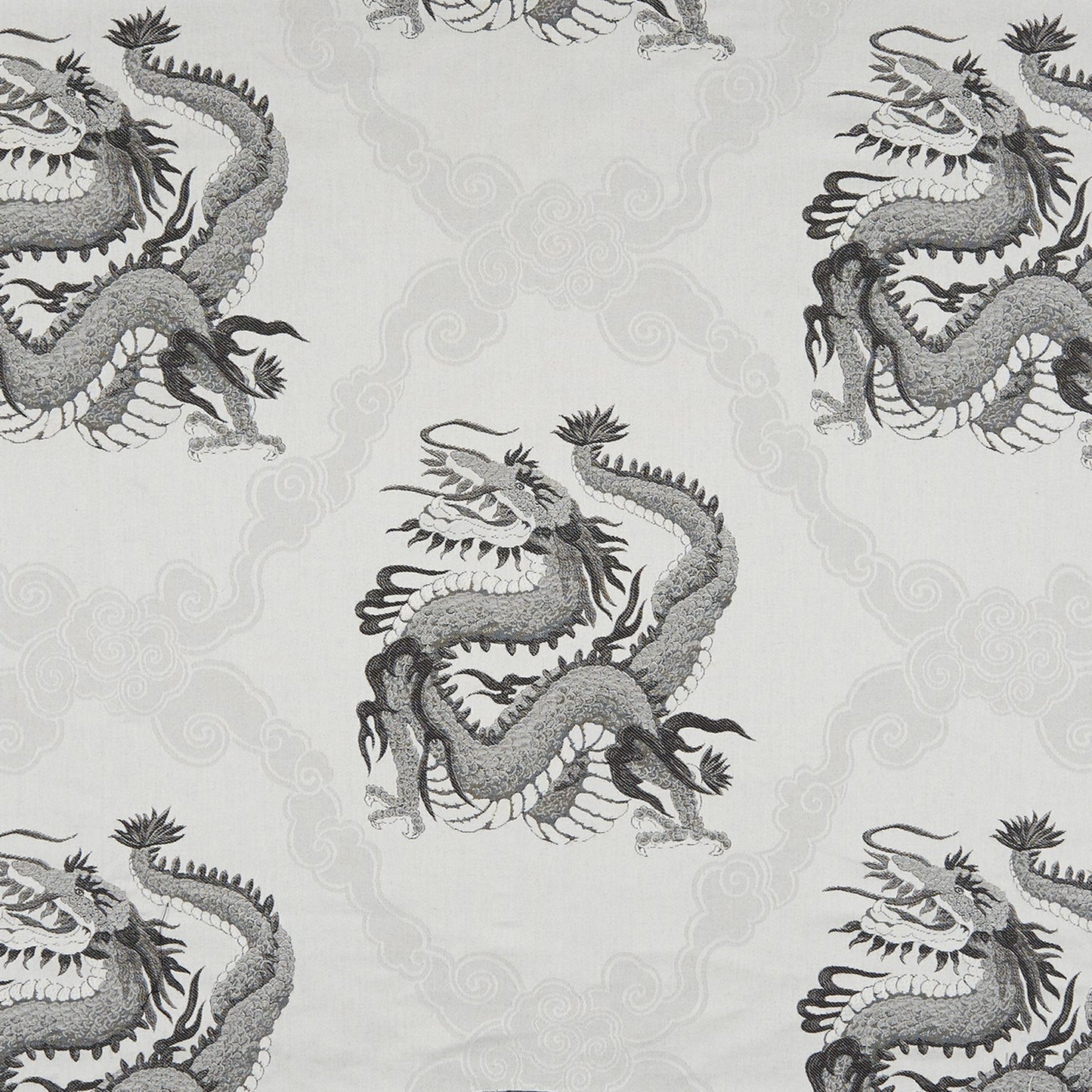 Grey and charcoal dragons on a pale background; oriental-style jacquard fabric with cloud motifs.