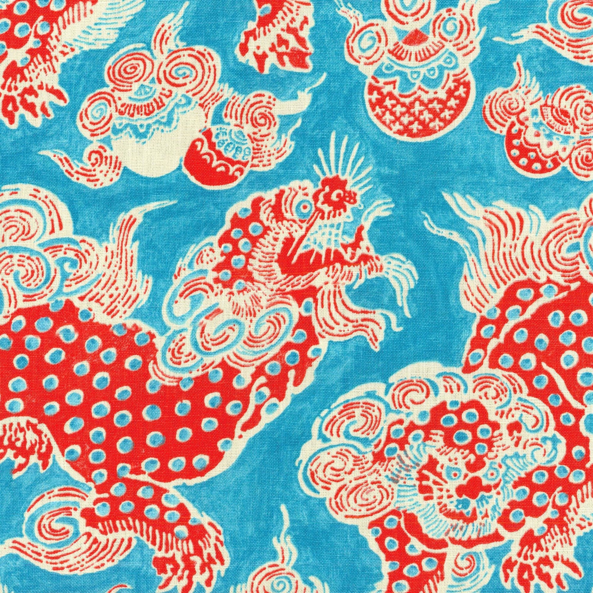 Blue linen fabric with red dragon print and white detailing; bold Asian dragon motif, lightweight textile for scarves or crafts.
