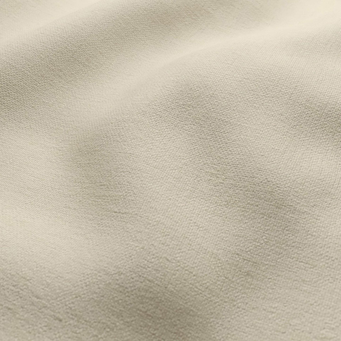 Beige soft suede-like fabric close-up with fine nap & gentle folds; versatile for upholstery & apparel.