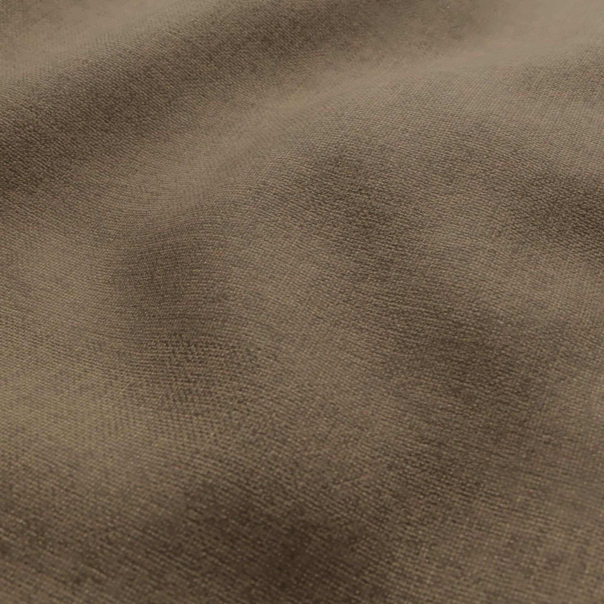Close-up of brown woven fabric with soft folds and subtle texture.