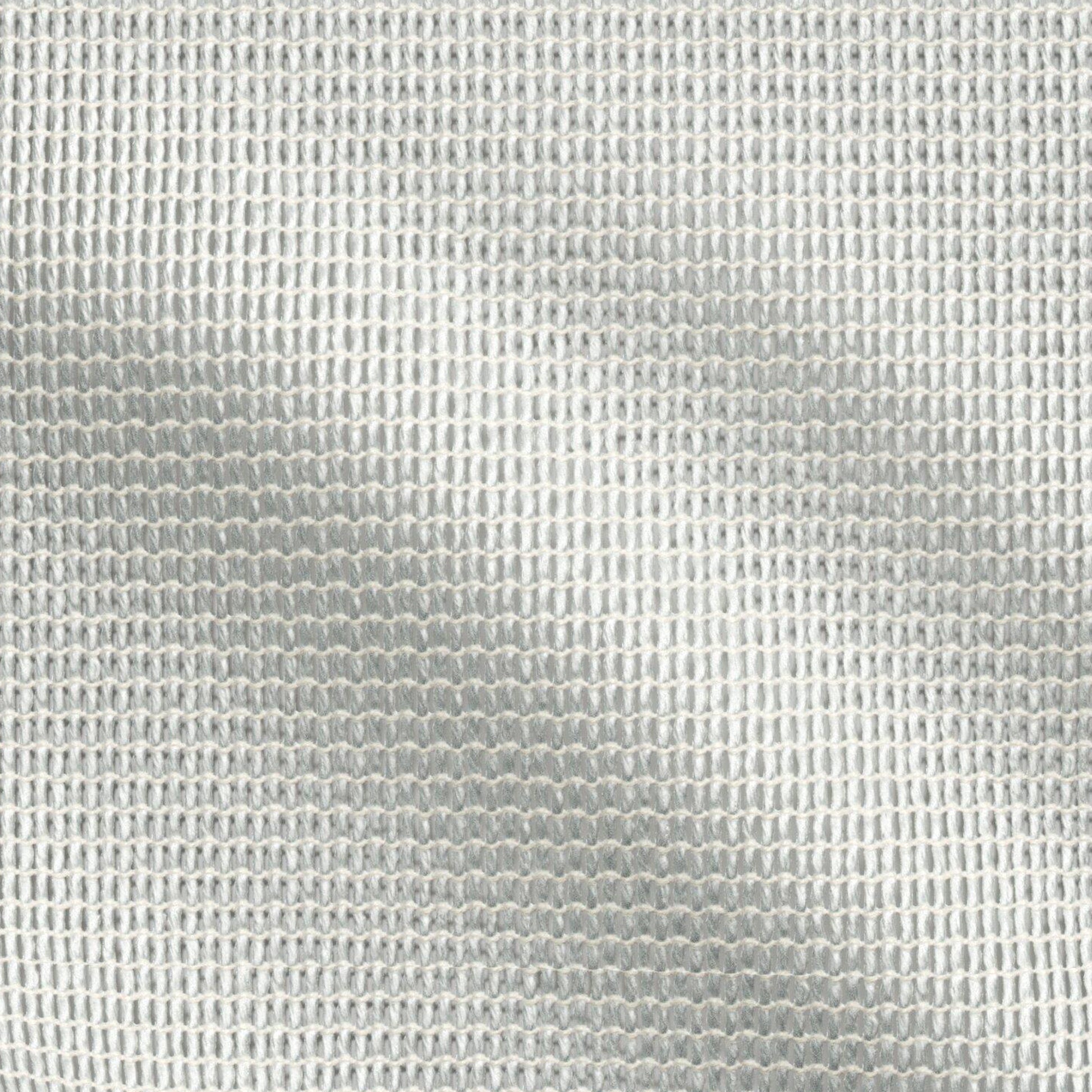 Close-up of pale seafoam green and cream sheer woven fabric with a subtle grid pattern.
