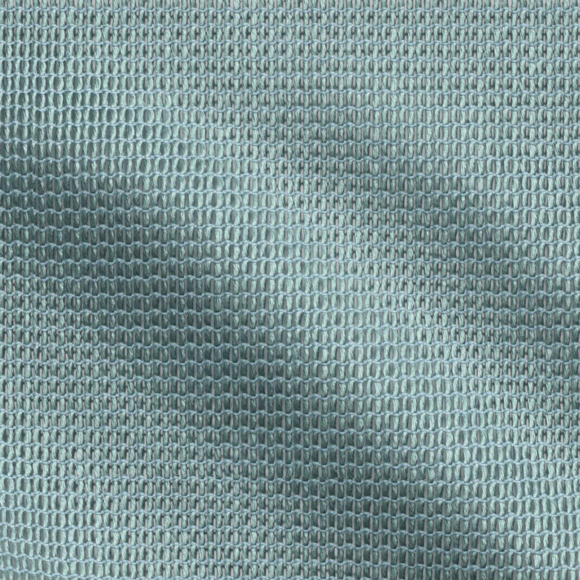 Close-up of teal woven fabric with tiny oval loops and a soft, mesh-like texture.