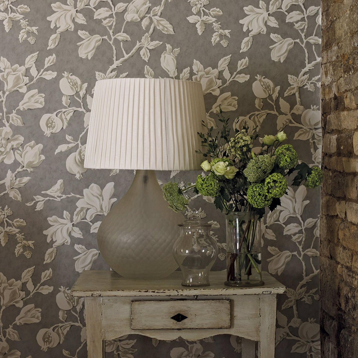 Sanderson Magnolia & Pomegranate Wallpaper in Silver/Linen (DWOW215722) showcasing large-scale magnolia and pomegranate trail design with birds on textured background — perfect for a sophisticated accent wall