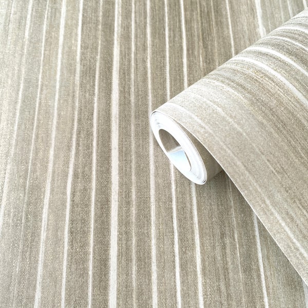 Beige wallpaper roll with cream and taupe vertical stripes, partially unrolled.