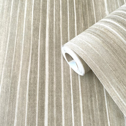 Beige wallpaper roll with cream and taupe vertical stripes, partially unrolled.