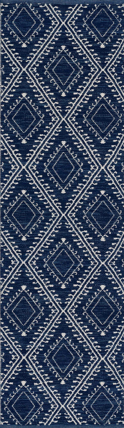 Indigo blue rug with a white diamond lattice geometric pattern; 5' x 8' area rug.