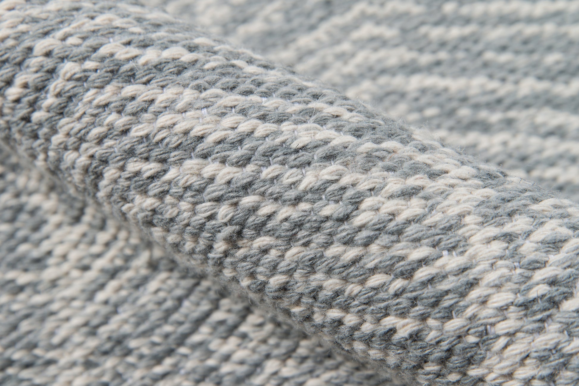 Close-up of chunky heather gray-blue rug fibers creating a textured surface (4' x 6' rug).