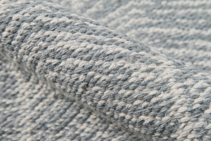 Close-up of chunky heather gray-blue rug fibers creating a textured surface (4' x 6' rug).