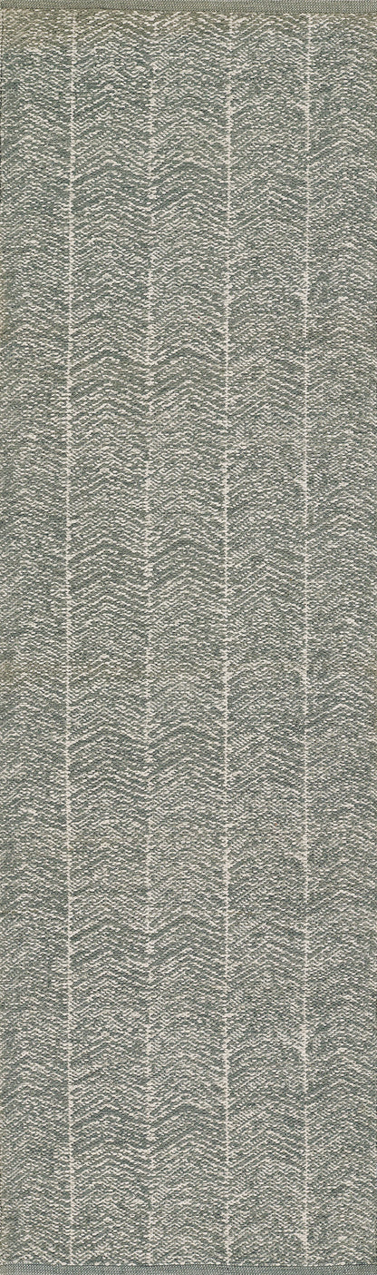 Grey textured woven rug with a repeating vertical chevron/herringbone pattern.