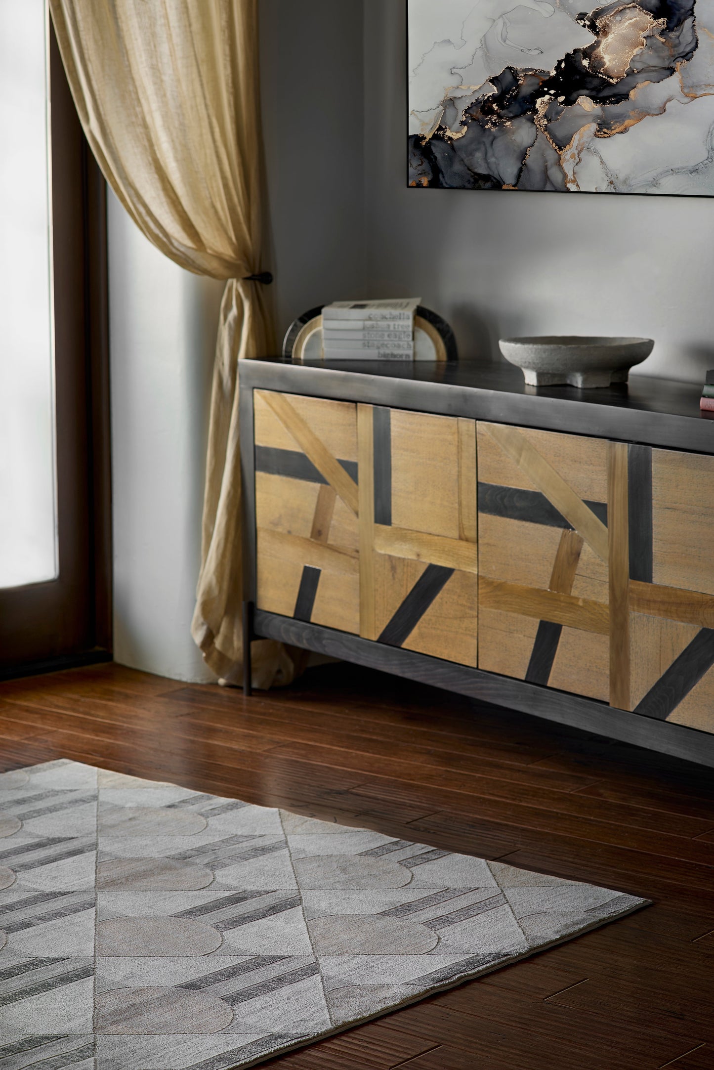 Geometric-pattern rug in a modern living room, 2' x 3'.