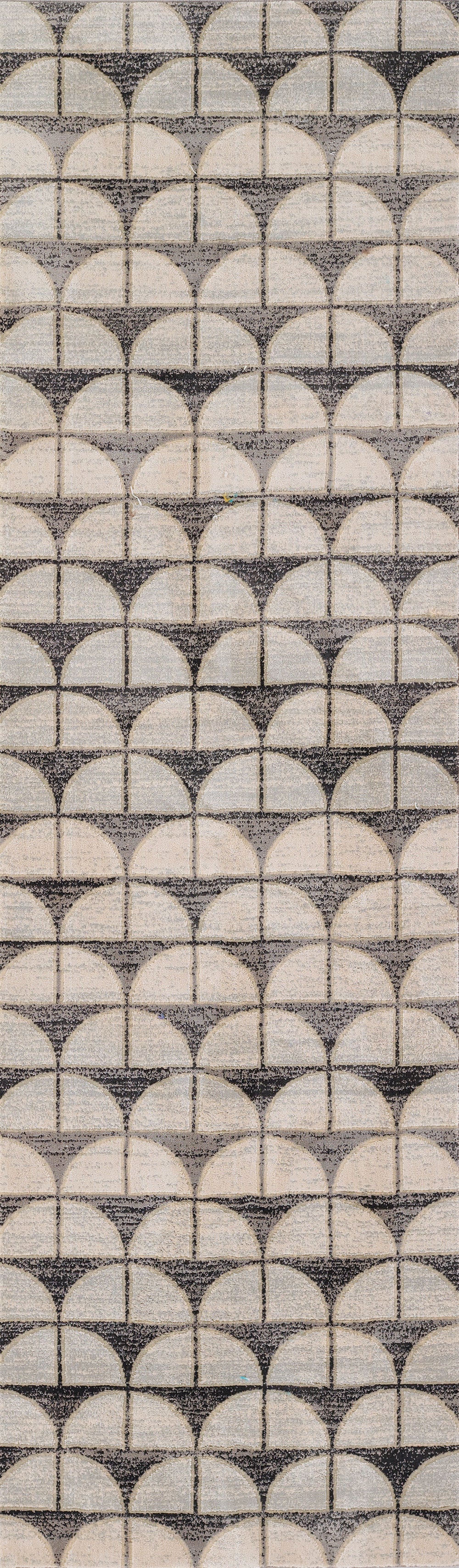 Geometric textile with interlocking half-circle scallop motif in beige and gray.