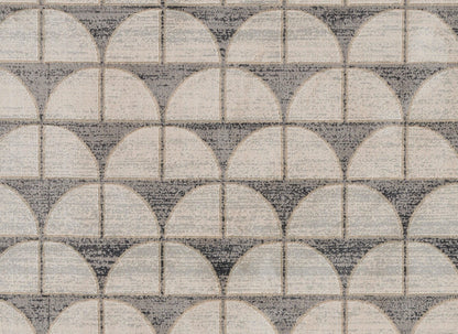Gray and ivory scalloped tile pattern with semicircles forming circular motifs; ceramic/cement-look floor or backsplash tile.