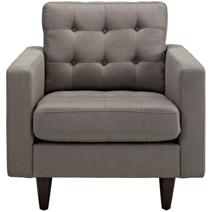 Gray fabric armchair with tufted back, cushioned seat, square arms, dark wood tapered legs.