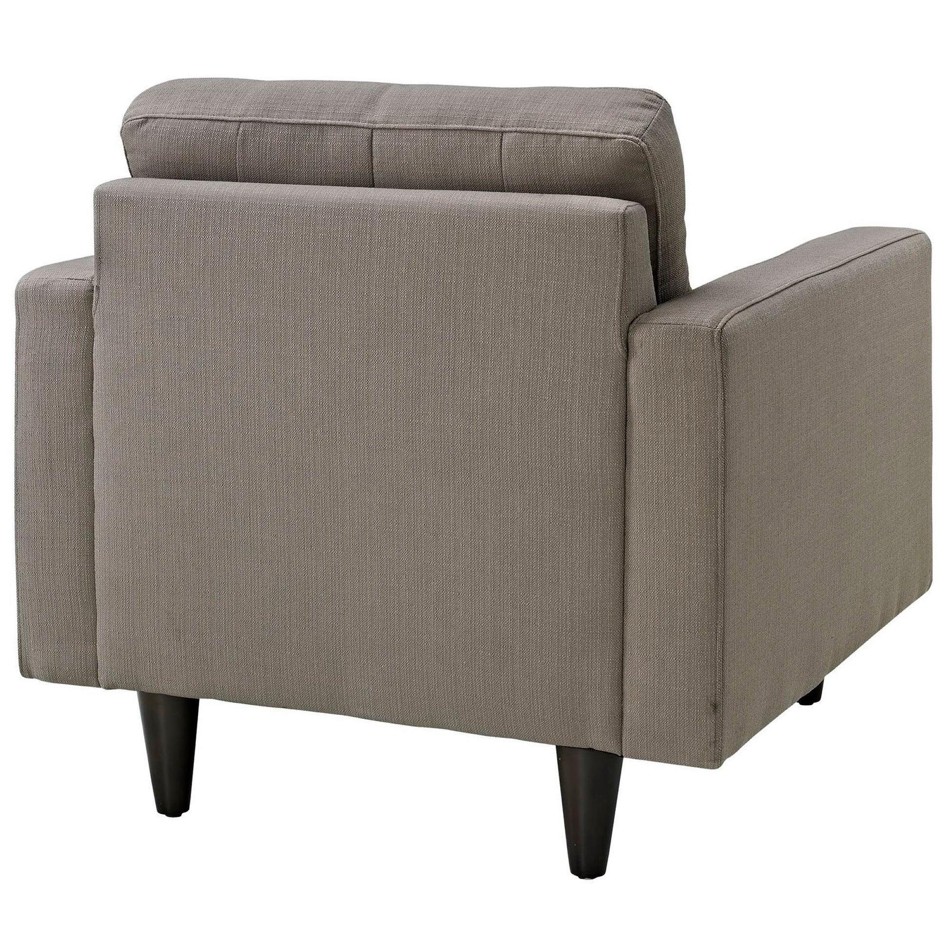 Gray fabric armchair with boxy arms, back cushion and dark tapered legs in a mid-century modern style.