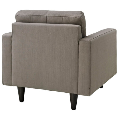 Gray fabric armchair with boxy arms, back cushion and dark tapered legs in a mid-century modern style.