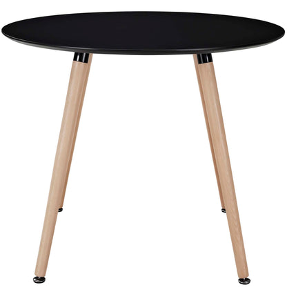Round black dining table with three natural wood tripod legs