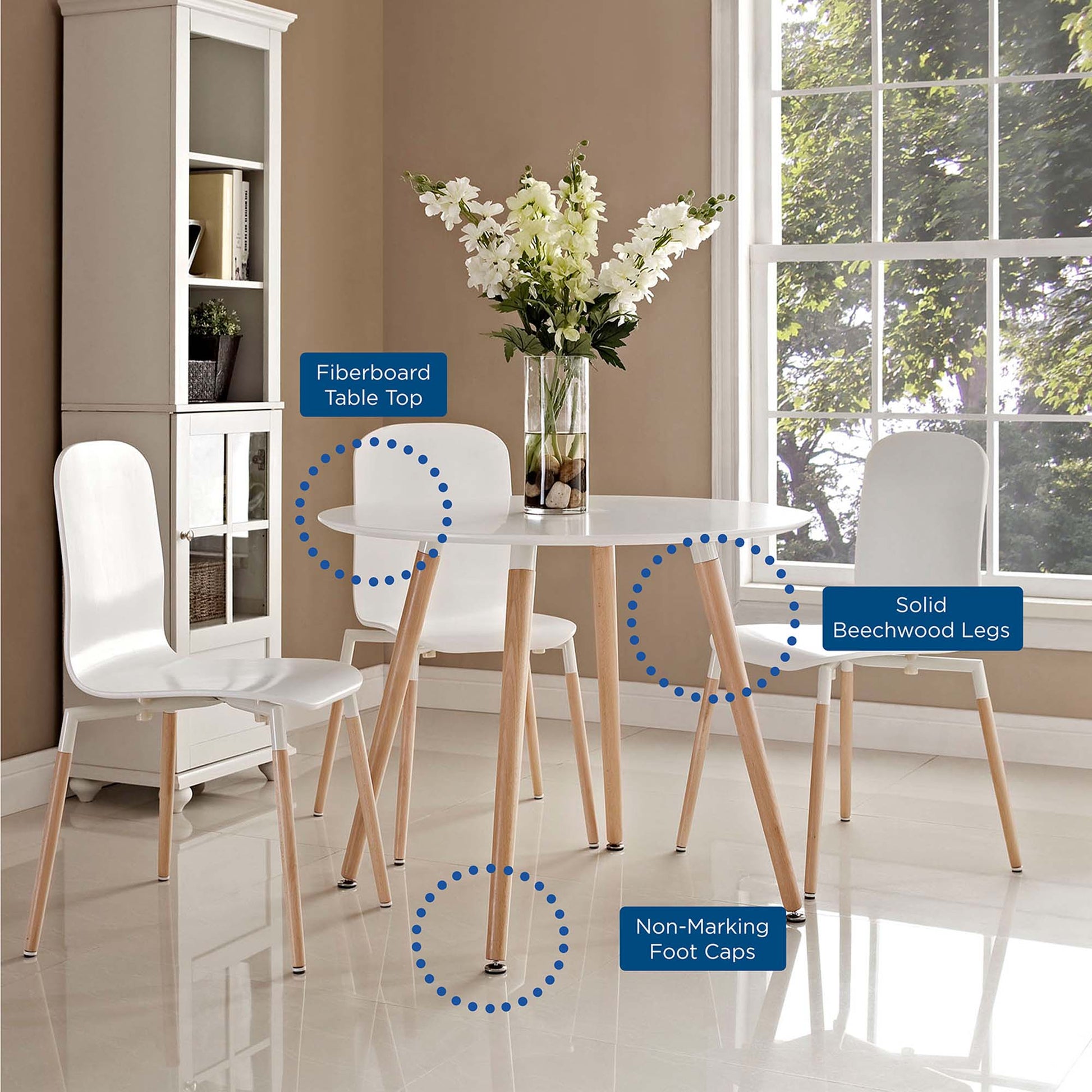 Round white dining table with fiberboard top and solid beechwood legs; white molded chairs and non-marking foot caps.
