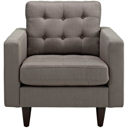 Pair of gray textured fabric upholstered armchairs with tufted back and seat, boxy arms, and tapered dark wood legs.