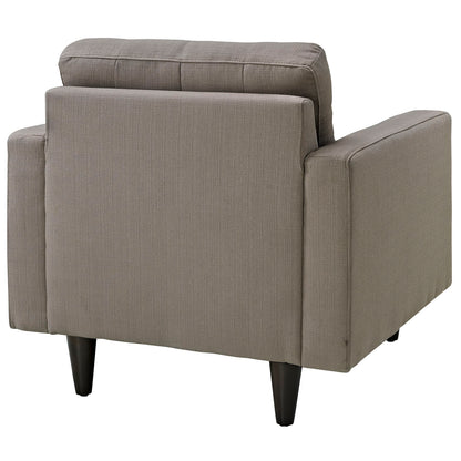 Gray fabric upholstered armchair with a boxy silhouette, back cushions, and dark tapered wood legs.