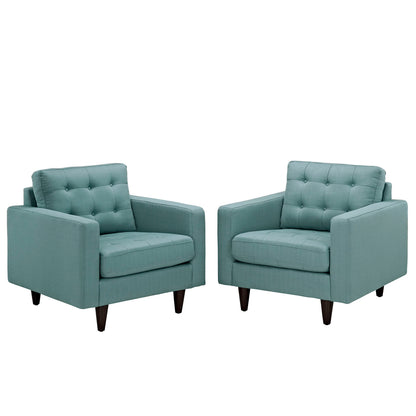Pair of teal fabric armchairs with tufted back cushions, square arms, and mid-century wooden legs.