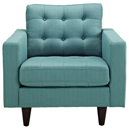 Teal tufted fabric armchair with square arms, cushioned seat & back, button-tufted back, dark wooden tapered legs.