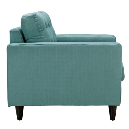 Teal fabric upholstered armchair with square arms, cushioned back, and dark tapered wooden legs.