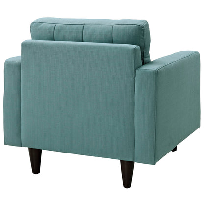 Teal fabric upholstered armchair with boxed arms, segmented back cushion, and dark wood tapered legs.