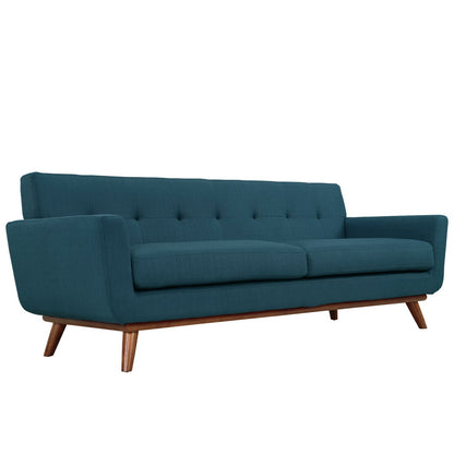 Azure-teal mid-century sofa with tufted back, two seat cushions, square arms, and angled wooden legs.
