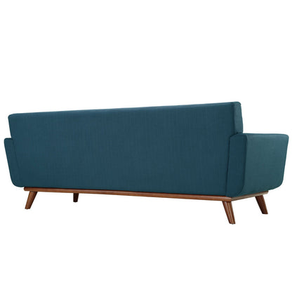 Teal blue fabric mid-century sofa with squared arms, cushioned back, and angled wooden legs.