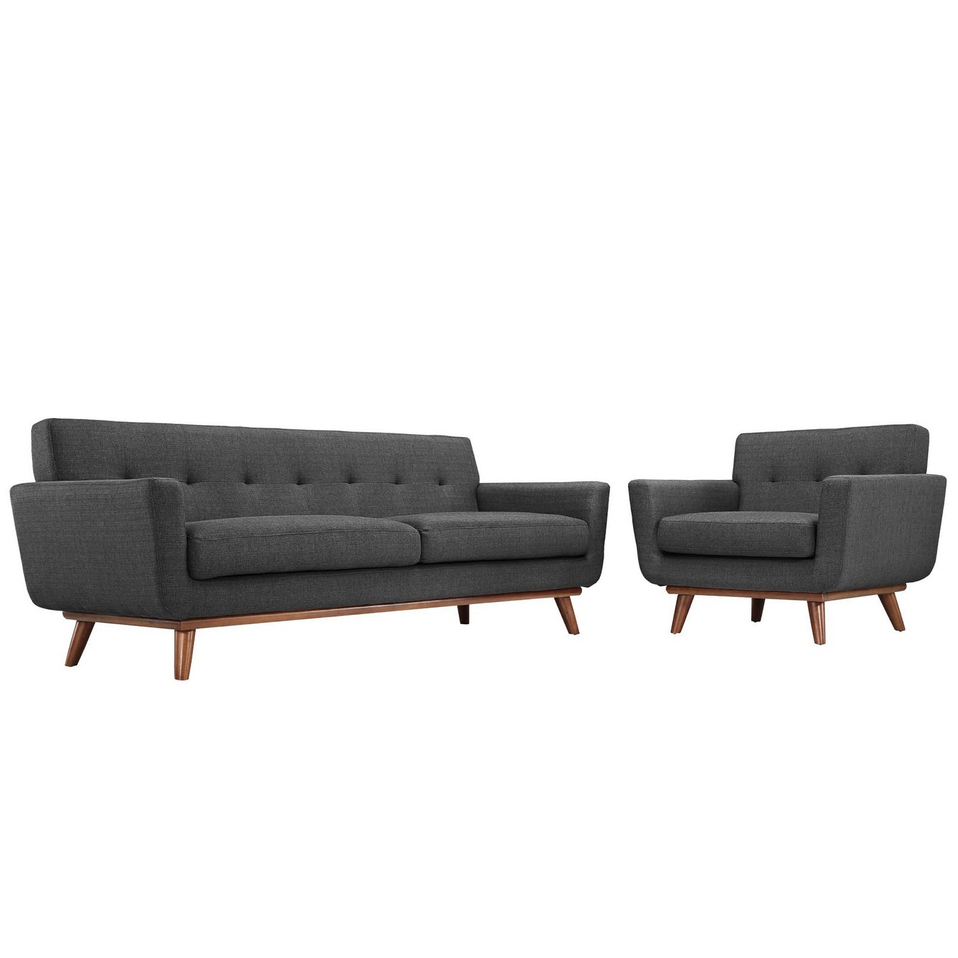 Dark gray mid-century modern sofa with tufted back and matching armchair on wooden legs.