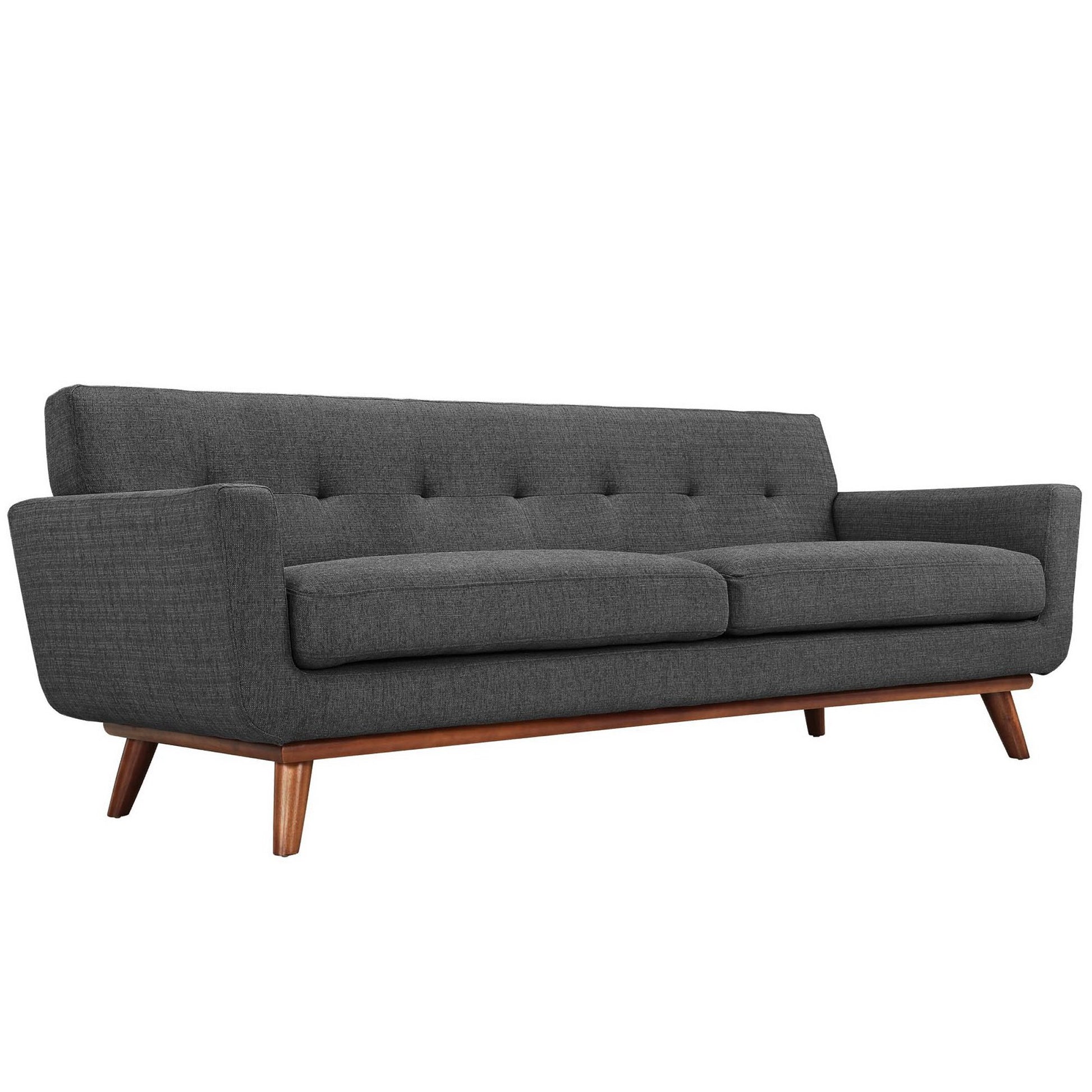 Dark gray fabric sofa in mid-century style with tufted back, two-seat cushions, and angled wooden legs.