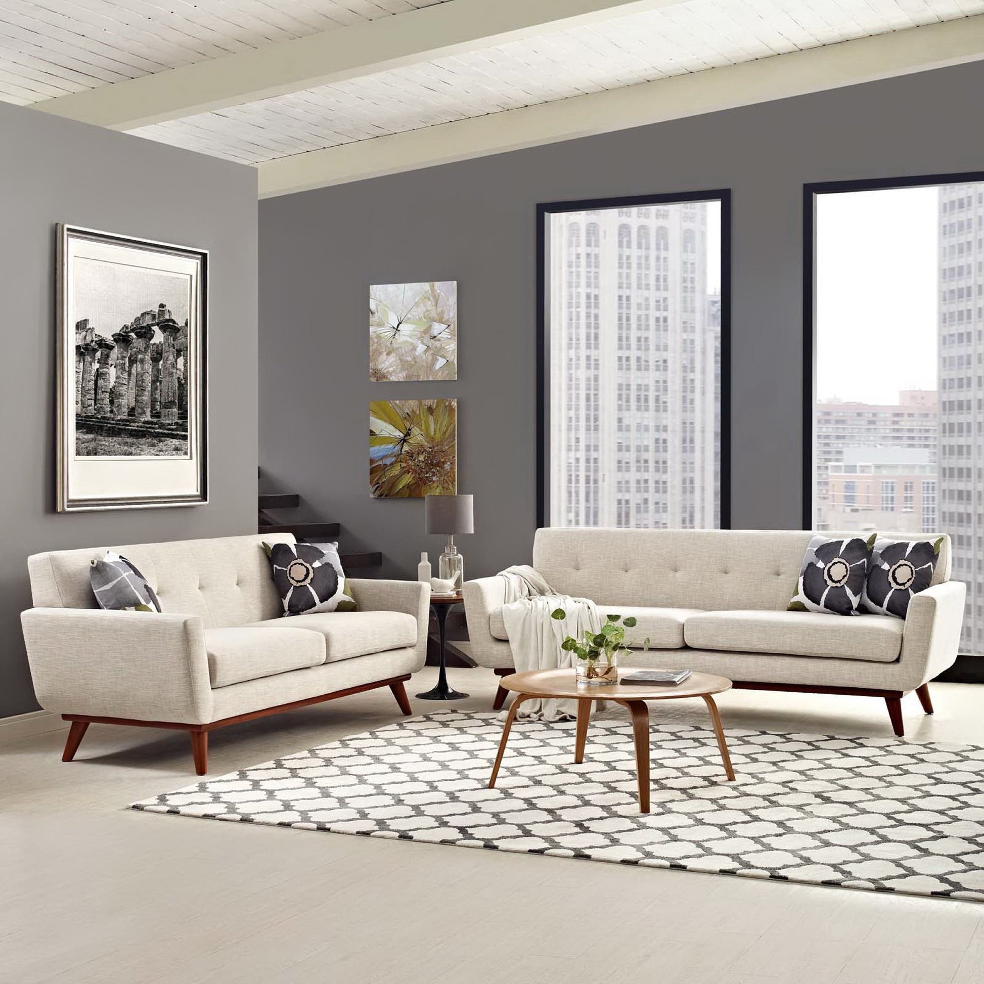 Neutral beige mid-century sofa set with wood legs, round wood coffee table, patterned rug, city view windows.